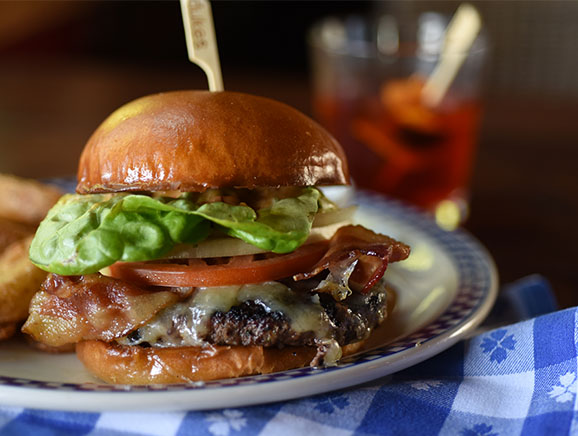 Dukes Seafood Cheeseburger with bacon, lettuce, tomato, and onion